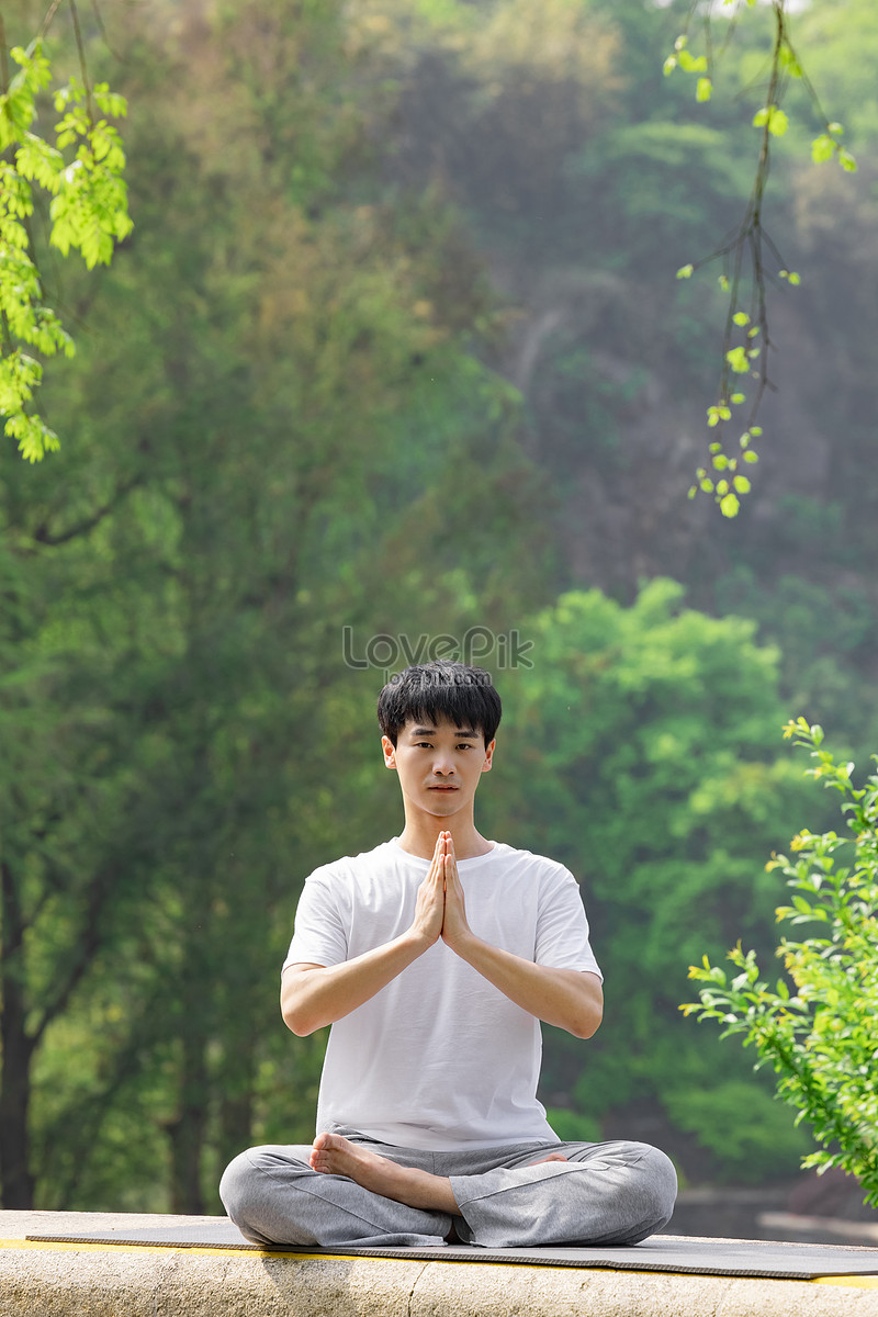 Premium Photo  A man doing yoga zen relaxation posture meditation exercise  in tropical garden