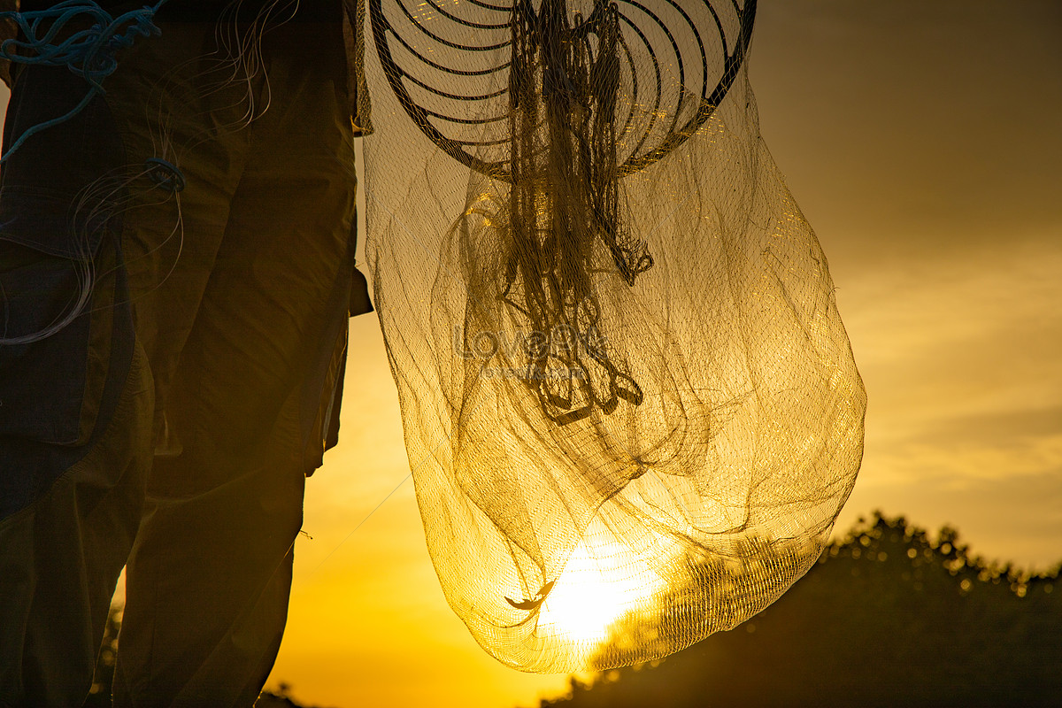 Premium Photo  Fishing net on the pier background with sun flare