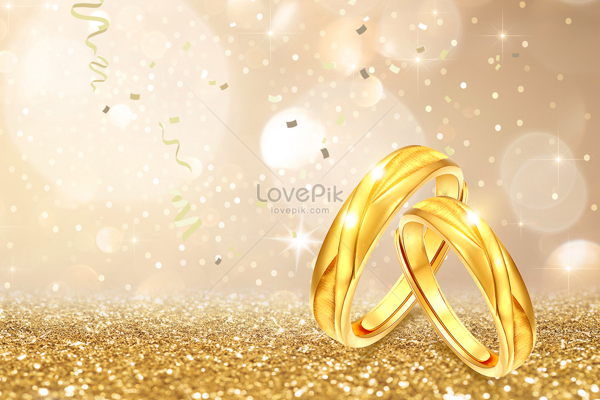 Two Golden Wedding Rings And Feather - Light Soft Background | TLJ Studios