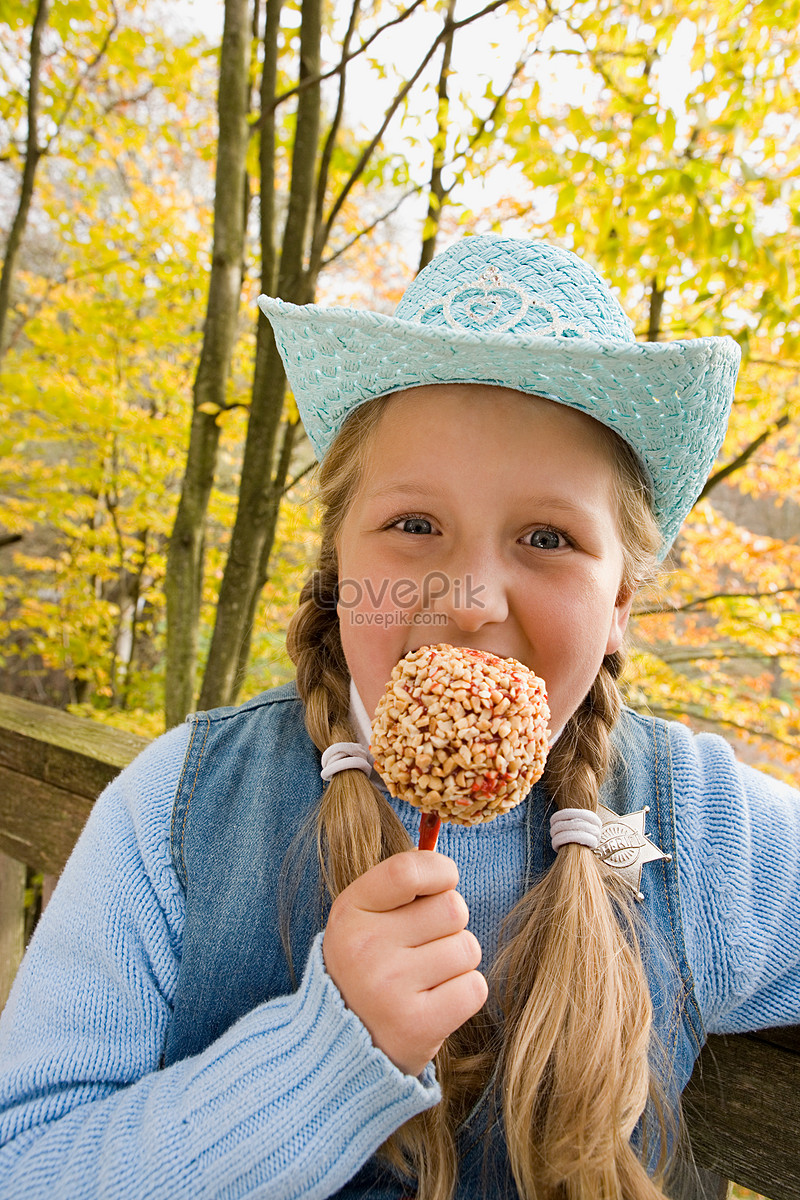 Girl Eating Toffee Apple Picture And Hd Photos Free Download On Lovepik