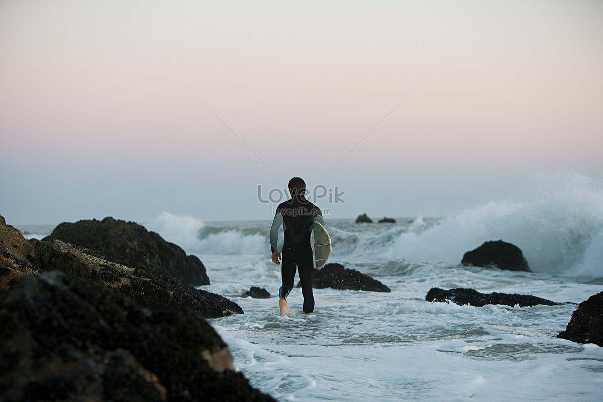 Sea standing. Man Wave back view.