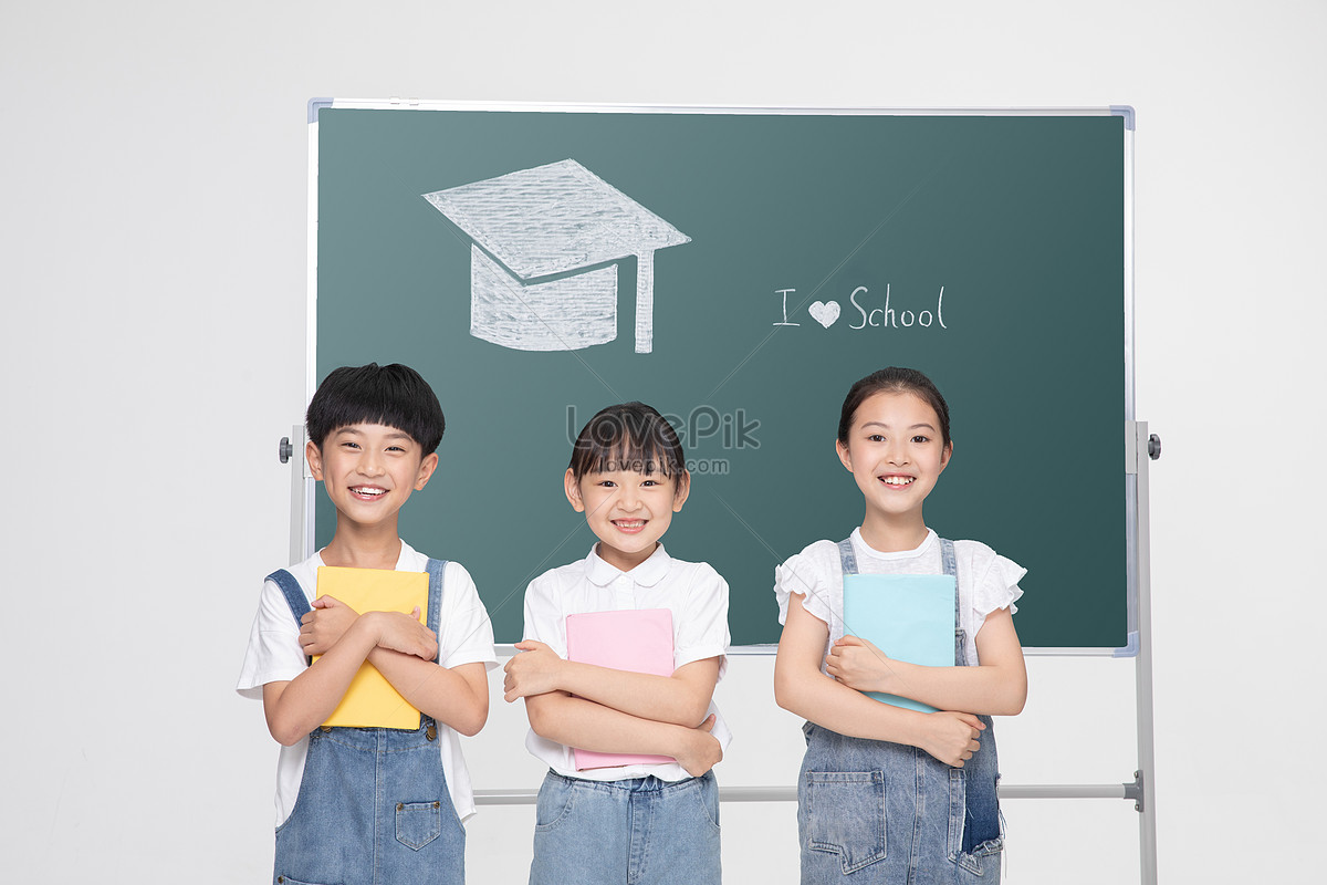 Одноклассники доска. We are classmates pictures on the blackboard. Child holding blackboard in hand standing next to the teacher.