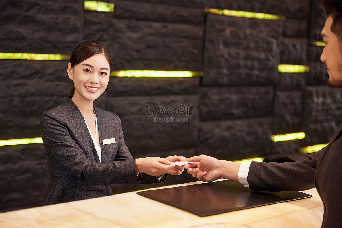 Hotel Front Desk Staff Check In For Customers Picture And HD Photos ...