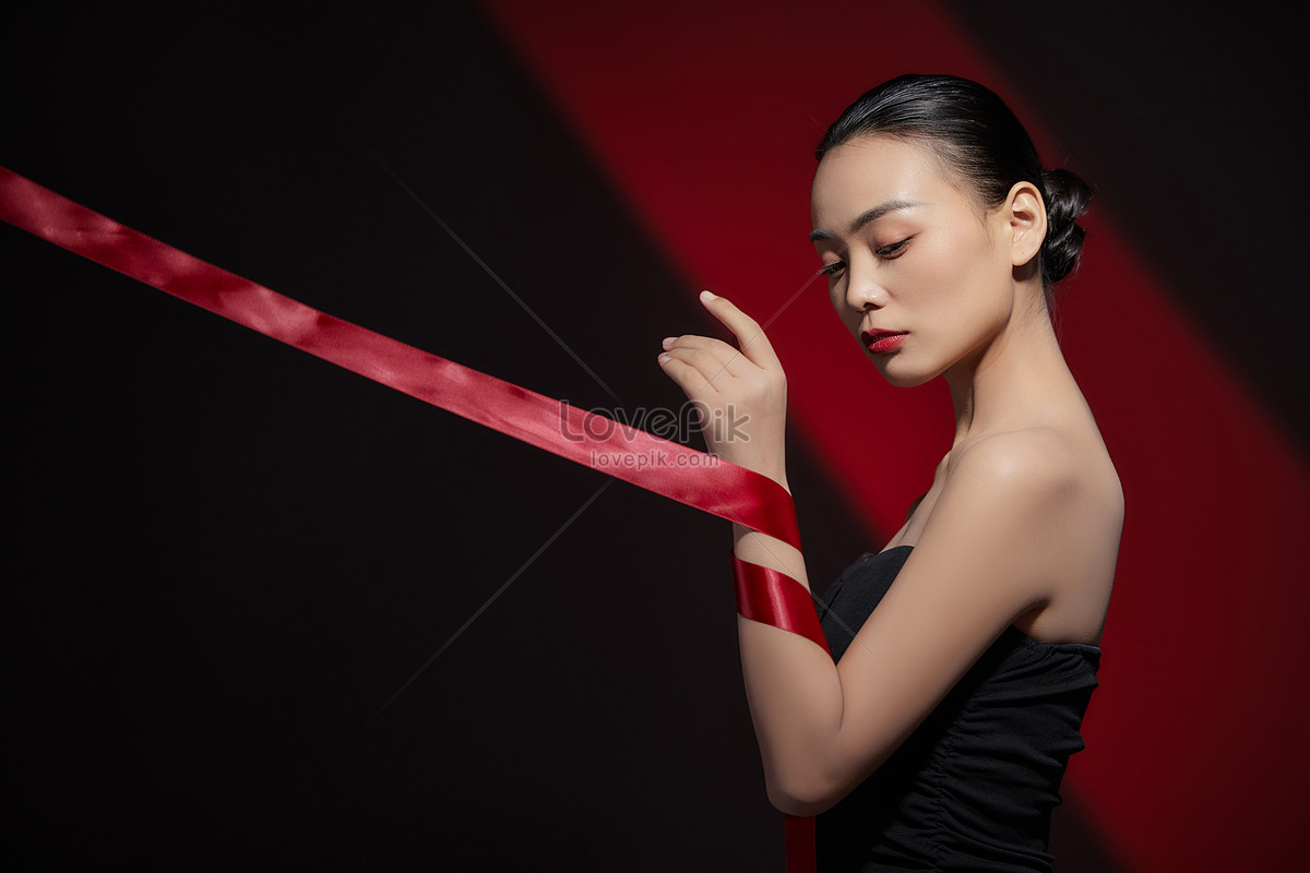 Beauty Women With Arms Wrapped In Ribbons Picture.