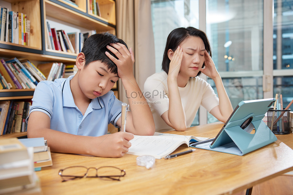 A helpless mother helping her son with homework, irritable, student, trouble HD Photo